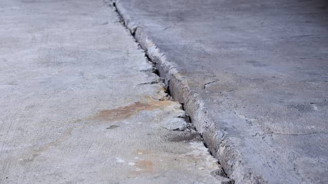 Concrete slab gap from settling that may need leveling